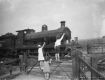 children waving to the train driver . 1936